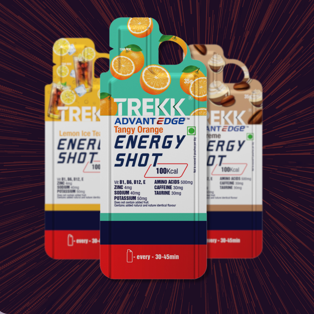 TREKK energy shot packaging design featuring three colorful flavor variants with Tangy Orange in the foreground.