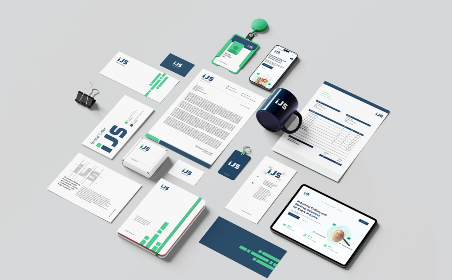 IJS brand identity showcase featuring business cards, stationery, mug, ID card, keychain, mobile interface, and website displayed in a clean blue-and-green visual system.