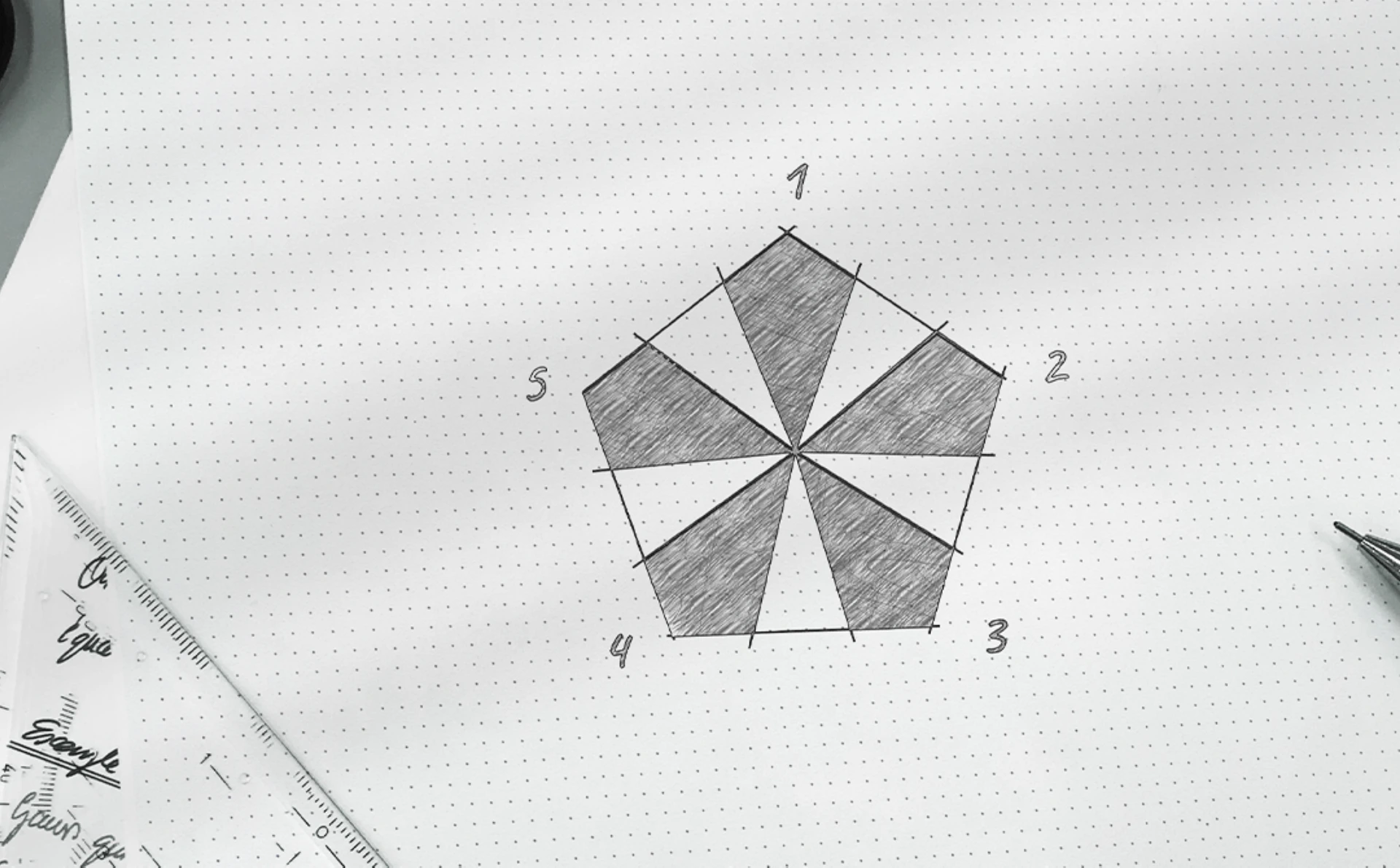 Hand-drawn five-part geometric architectural concept sketched on dotted paper, with shaded sections numbered 1 to 5 and a ruler beside the drawing.
