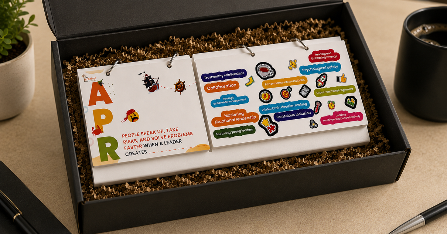 Leadership training workbook cards displayed inside a premium black presentation box, featuring colourful illustrations, leadership concepts, collaboration, psychological safety, decision-making, and team development themes.